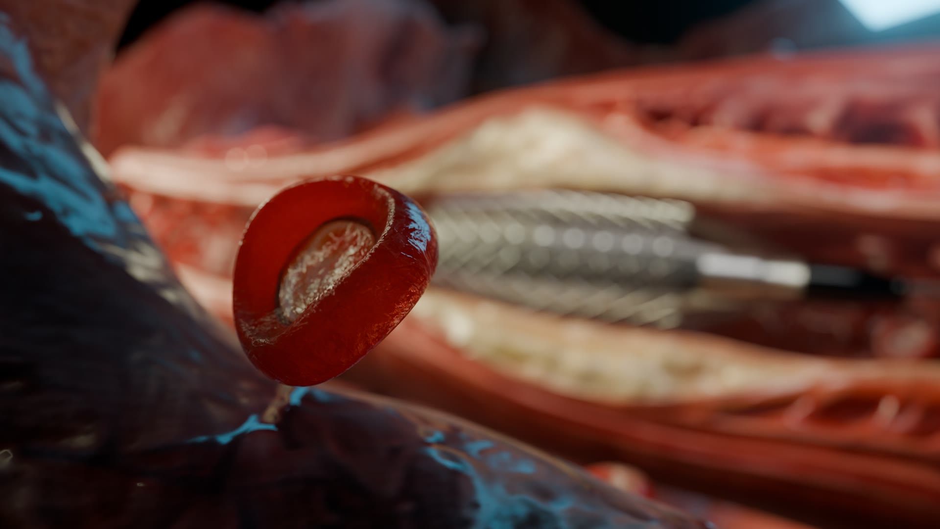 A red blood cell in the foreground, the device behind it
